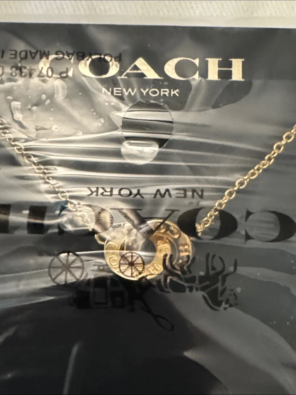 Coach Gold and White Round Pendant Necklace
